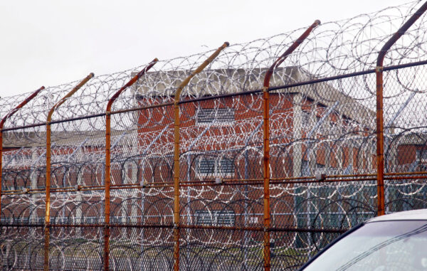 A security fence surrounds the inmate housing on New York's Rikers Island correctional facility. Photo: Bebeto Matthews/AP