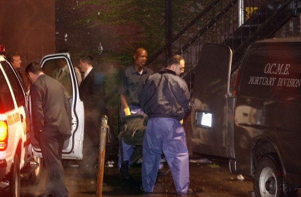 FILE - The body of Jason Mizell, a.k.a. Jam Master Jay, a member of the pioneering rap trio Run DMC, is removed from a recording studio where he was shot and killed, Wednesday, Oct. 30, 2002 in Queens, New York. (AP Photo/Newsday, Ken Sawchuk)