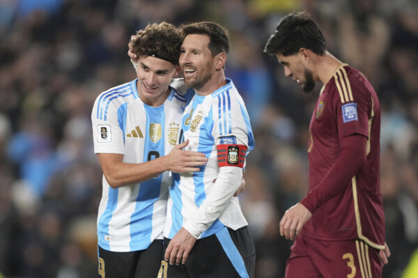 Argentina's Lionel Messi, center, celebrates with Julian Alvarez after scoring his side's opening goal against Venezuela during a World Cup 2026 qualifying soccer match at the Monumental stadium in Buenos Aires, Argentina, Thursday, Sept. 4, 2025. Photo: Natacha Pisarenko/AP