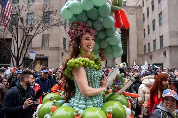 Tommi May wears a costume of balloons as they participate in the Easter Bonnet Parade on Fifth Avenue, Sunday, April 5, 2026, in New York. (AP Photo/Adam Gray)