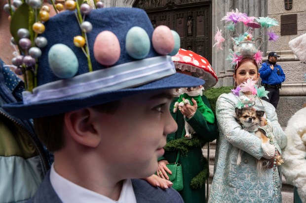Nolan, 11, looks at people as they participate in the Easter Bonnet Parade on Fifth Avenue, Sunday, April 5, 2026, in New York. (AP Photo/Adam Gray)