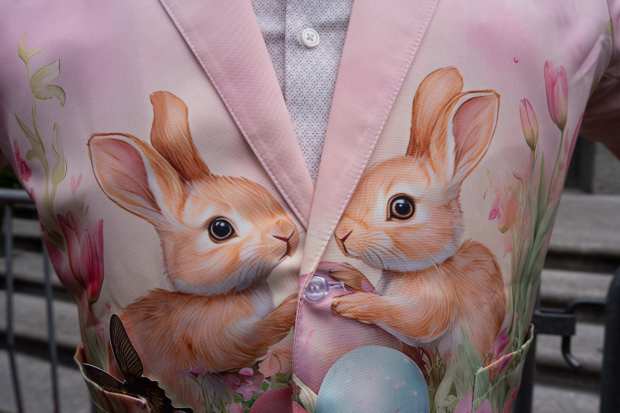 A person wears a rabbit themed jacket during the Easter Bonnet Parade on Fifth Avenue, Sunday, April 5, 2026, in New York. (AP Photo/Adam Gray)