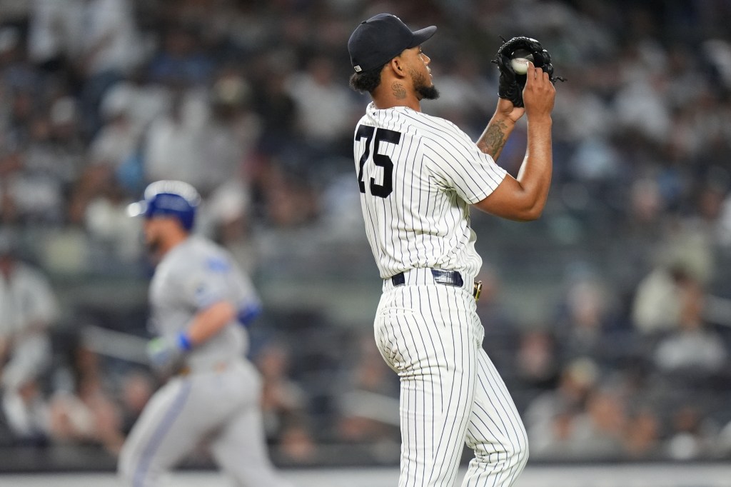 New York Yankees pitcher Camilo Doval (75) reacts as Kansas City Royals' Vinnie Pasquantino runs the bases after hitting a home run during the eighth inning of a baseball game Friday, April 17, 2026, in New York. 