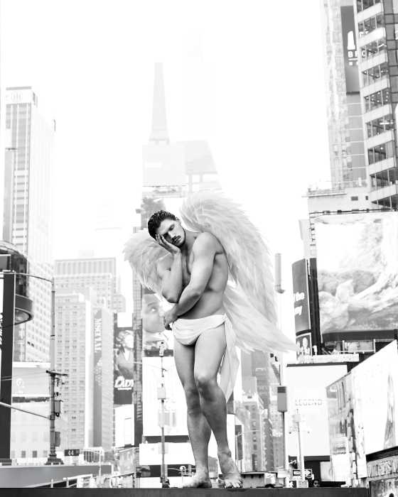 An angel stands tall in Times Square.