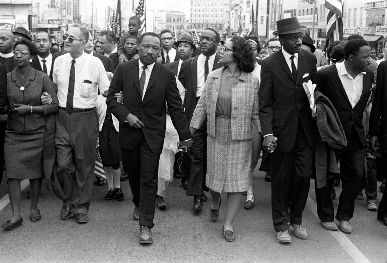 Black and white photo of Martin Luther King Jr. leading the 1965 Selma-to-Montgomery march, part of the Bronx Boys photography exhibition at The Breman in Atlanta.