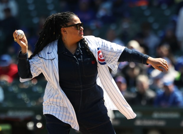 Actor and comedian Michelle Buteau throws a ceremonial first pitch before a Cubs-Mets game Saturday, April 18, 2026, at Wrigley Field. (John J. Kim/Chicago Tribune)
