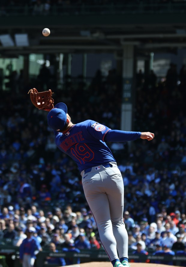 Mets third baseman Bo Bichette catches a pop-up from Cubs first baseman Michael Busch in the first inning Saturday, April 18, 2026, at Wrigley Field. (John J. Kim/Chicago Tribune)