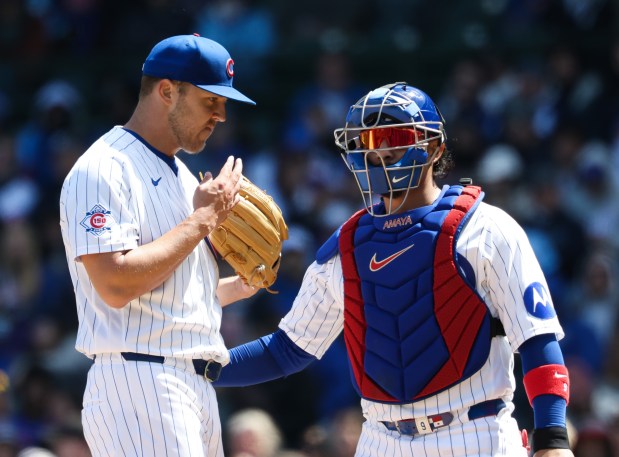 Cubs starting pitcher Jameson Taillon, left, and catcher Miguel Amaya talk in the second inning against the Mets on Saturday, April 18, 2026, at Wrigley Field. (John J. Kim/Chicago Tribune)