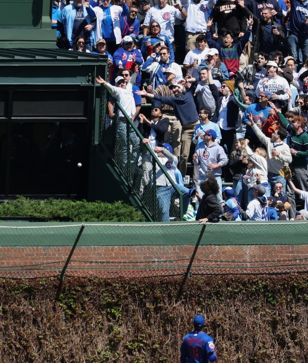 A ball hit by Cubs left fielder Ian Happ flies into the batter's eye for a home run in the second inning against the Mets on Saturday, April 18, 2026, at Wrigley Field. (John J. Kim/Chicago Tribune)