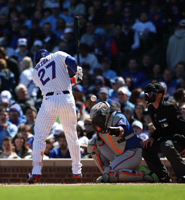 Cubs right fielder Seiya Suzuki is hit by a pitch from Mets starter Freddy Peralta in the second inning Saturday, April 18, 2026, at Wrigley Field. (John J. Kim/Chicago Tribune)