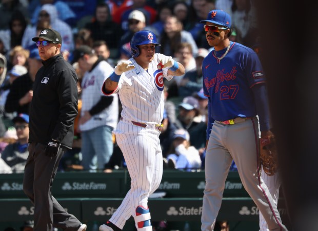 Cubs designated hitter Moisés Ballesteros gestures toward the dugout after hitting a single in the fourth inning against the Mets on Saturday, April 18, 2026, at Wrigley Field. (John J. Kim/Chicago Tribune)