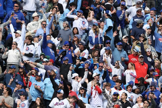 Fans celebrate a three-run home run by Cubs pinch hitter Carson Kelly in the sixth inning against the Mets on Saturday, April 18, 2026, at Wrigley Field. (John J. Kim/Chicago Tribune)