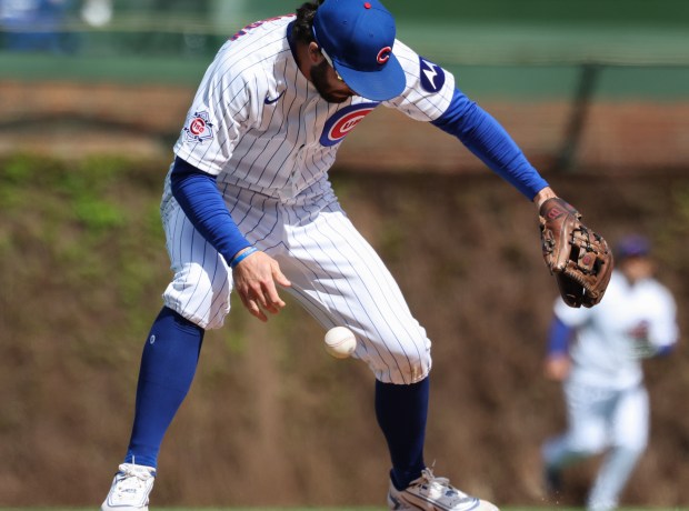 Cubs shortstop Dansby Swanson stops the ball with his legs, hit by Mets shortstop Francisco Lindor for a single, in the eighth inning Saturday, April 18, 2026, at Wrigley Field. (John J. Kim/Chicago Tribune)