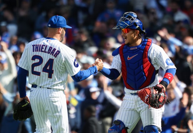 Cubs reliever Caleb Thielbar and catcher Miguel Amaya celebrate a 4-2 win over the Mets on Saturday, April 18, 2026, at Wrigley Field. (John J. Kim/Chicago Tribune)