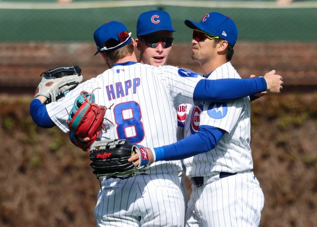 Cubs outfielders Ian Happ, from left, Pete Crow-Armstrong and Seiya Suzuki celebrate a 4-2 win over the Mets on Saturday, April 18, 2026, at Wrigley Field. (John J. Kim/Chicago Tribune)