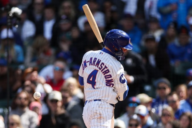 Cubs center fielder Pete Crow-Armstrong (4) gets hit by a pitch from Mets pitcher David Peterson (23) during the fifth inning at Wrigley Field April 19, 2026, in Chicago. (Armando L. Sanchez/Chicago Tribune)