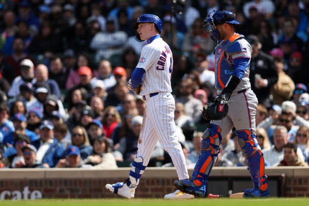 Cubs center fielder Pete Crow-Armstrong (4) walks to first after being hit by a pitch from Mets pitcher David Peterson (23) during the fifth inning at Wrigley Field April 19, 2026, in Chicago. (Armando L. Sanchez/Chicago Tribune)