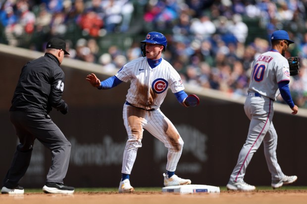 Cubs center fielder Pete Crow-Armstrong (4) look at an umpire after being tagged out at second base by Mets second baseman Marcus Semien (10) during the fifth inning at Wrigley Field April 19, 2026, in Chicago. (Armando L. Sanchez/Chicago Tribune)