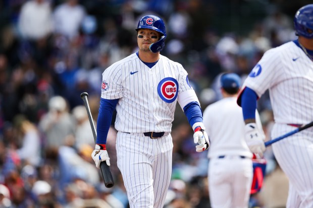 Cubs right fielder Seiya Suzuki (27) walks to the dugout after striking out with the bases loaded during the sixth inning against the Mets at Wrigley Field April 19, 2026, in Chicago. (Armando L. Sanchez/Chicago Tribune)