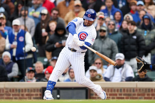 Cubs left fielder Michael Conforto (20) hits a RBI double during the ninth inning against the Mets at Wrigley Field April 19, 2026, in Chicago. (Armando L. Sanchez/Chicago Tribune)