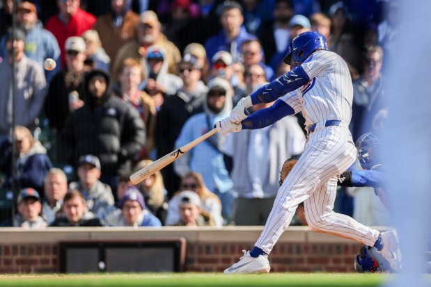 Cubs second baseman Nico Hoerner (2) hits a walk-off sacrifice fly bringing in Cubs center fielder Pete Crow-Armstrong (4) to give the Cubs a, 2-1, win over the Mets at Wrigley Field April 19, 2026, in Chicago. (Armando L. Sanchez/Chicago Tribune)