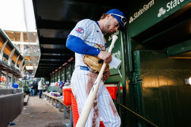 Cubs second baseman Nico Hoerner (2) walks to the locker room after hitting a walk-off sacrifice fly bringing in Cubs center fielder Pete Crow-Armstrong (4) to give the Cubs a, 2-1, win over the Mets at Wrigley Field April 19, 2026, in Chicago. (Armando L. Sanchez/Chicago Tribune)
