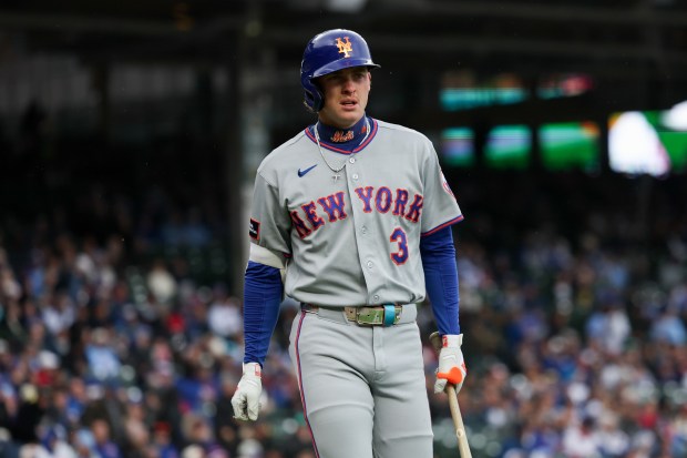 Mets outfielder Carson Benge (3) walks to the dugout after being struck out during the first inning against the Cubs at Wrigley Field April 19, 2026, in Chicago. (Armando L. Sanchez/Chicago Tribune)