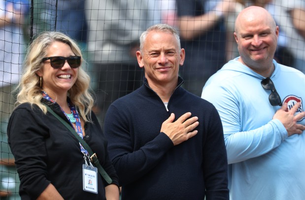 Chicago Cubs President of Baseball Operations Jed Hoyer stands for the national anthem ahead of a game between the Cubs and the New York Mets at Wrigley Field in Chicago on April 17, 2026. (Chris Sweda/Chicago Tribune)