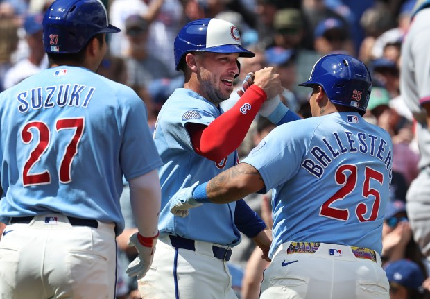 Chicago Cubs designated hitter Moisés Ballesteros (25) is congratulated by teammate Alex Bregman after Ballesteros hit a three-run homer in the first inning of a game against the New York Mets at Wrigley Field in Chicago on April 17, 2026. (Chris Sweda/Chicago Tribune)