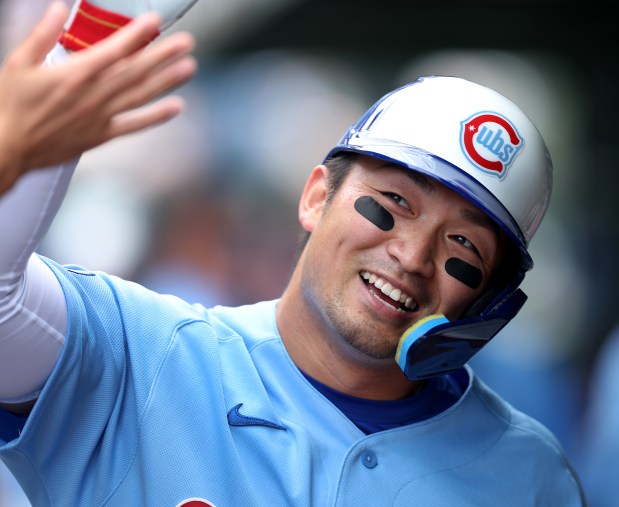 Chicago Cubs right fielder Seiya Suzuki flashes a smile in the dugout after scoring on a double by teammate Matt Shaw in the seventh inning of a game against the New York Mets at Wrigley Field in Chicago on April 17, 2026. (Chris Sweda/Chicago Tribune)