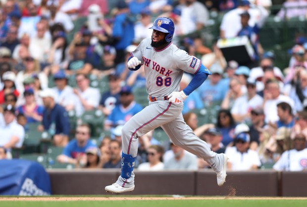 New York Mets center fielder Luis Robert Jr. (88) rounds the bases after hitting a double in the eighth inning of a game against the Chicago Cubs at Wrigley Field in Chicago on April 17, 2026. (Chris Sweda/Chicago Tribune)
