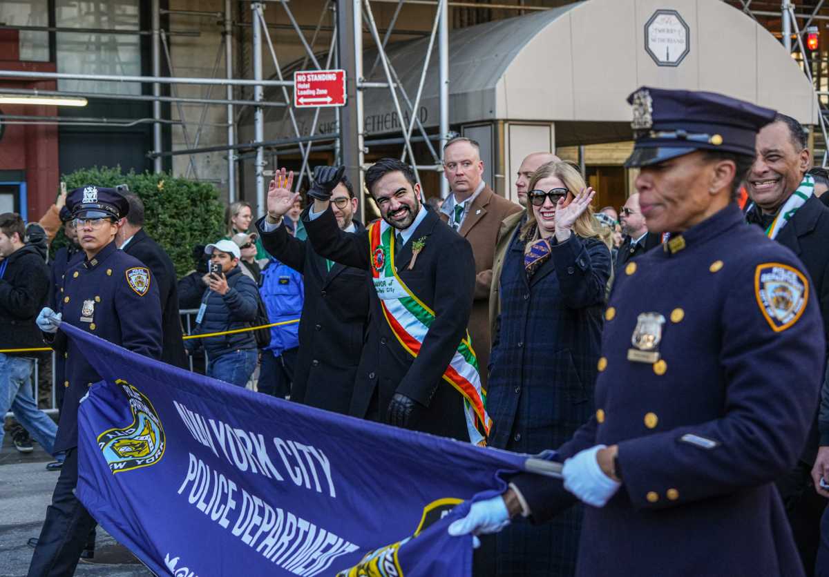 Mayor Mamdani and Police Commissioner Jessica Tisch march in the St. Patrick's Day parade.