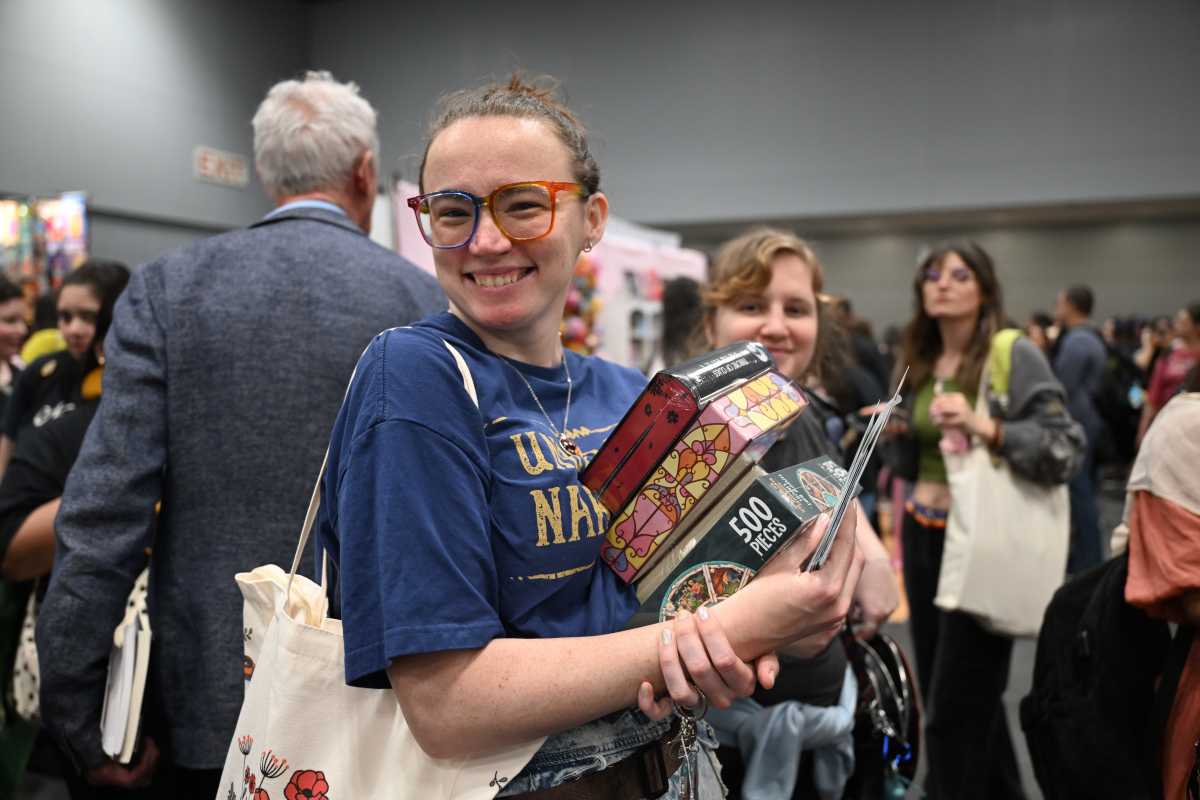 a girl with an armload of books