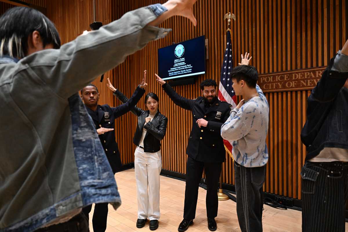 Big Ocean interacts with NYPD officers.