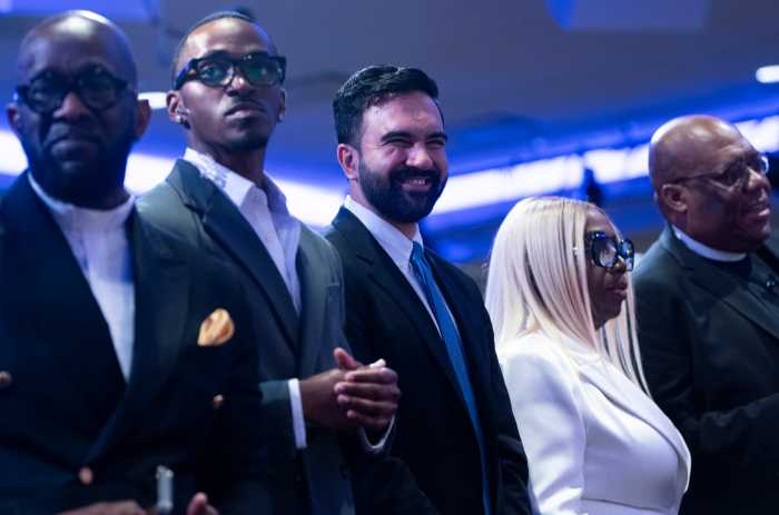 men in suits and a woman wearing white