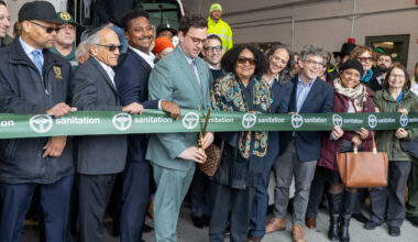 Participants in the ribbon-cutting, left to right: Ronald Prattis, vice president of Local 831; former DSNY Director of Real Estate Daniel Kline; Councilmember Chi Ossé; Sanitation Commissioner Gregory Anderson; former DSNY Assistant Commissioner Arlana Davis; Deputy Mayor for Operations Julia Kerson; Councilmember Lincoln Restler; and community advocates. Photo: DSNY