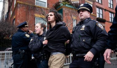 Police detain Emir Balat after he attempted to detonate an improvised explosive device during a counterprotest against far right influencer Jake Lang staging an anti-Islam protest outside Gracie Mansion, Saturday, March 7, 2026, in New York. (AP Photo/Julius Constantine Motal)