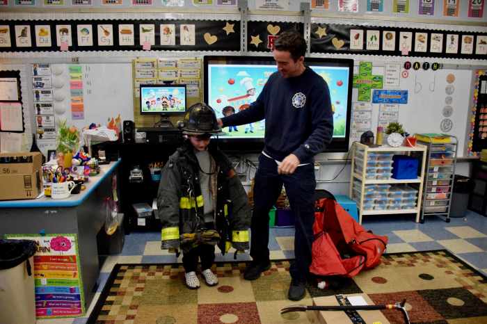 A firefighter told students about his work.