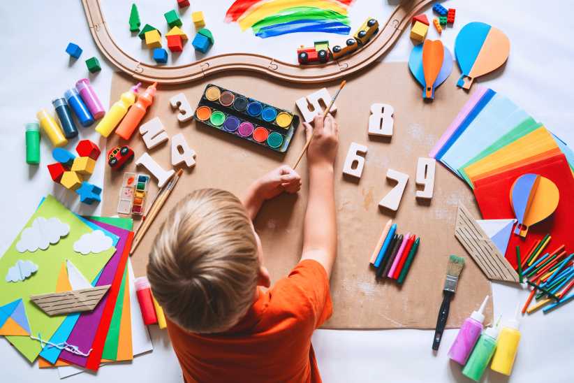 Child drawing and making crafts in school or daycare.Finally: NYC’s Free 2-K Will Cover a Full Workday for Parents