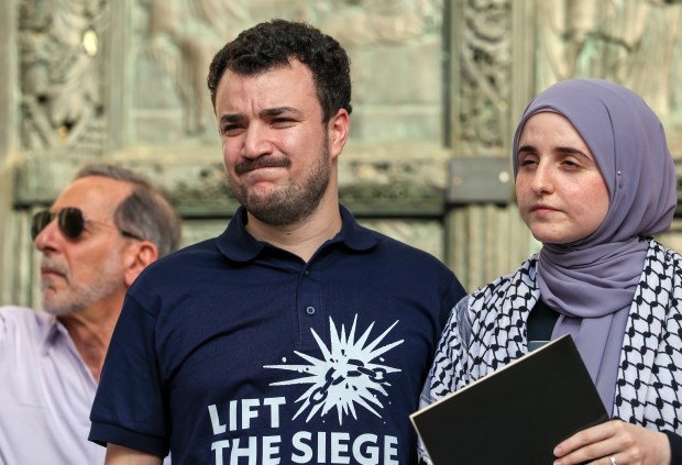 Palestinian activist Mahmoud Khalil stands with his wife, Noor Abdalla, as they speak and participate in a rally on the steps of the Cathedral of St. John the Divine in Manhattan on June 22, 2025 in New York City. (Photo by Spencer Platt/Getty Images)