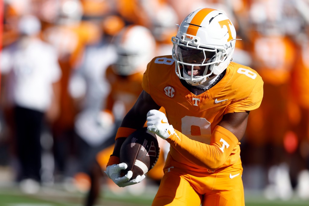 Colton Hood #8 of the Tennessee Volunteers returns an interception for a touchdown 