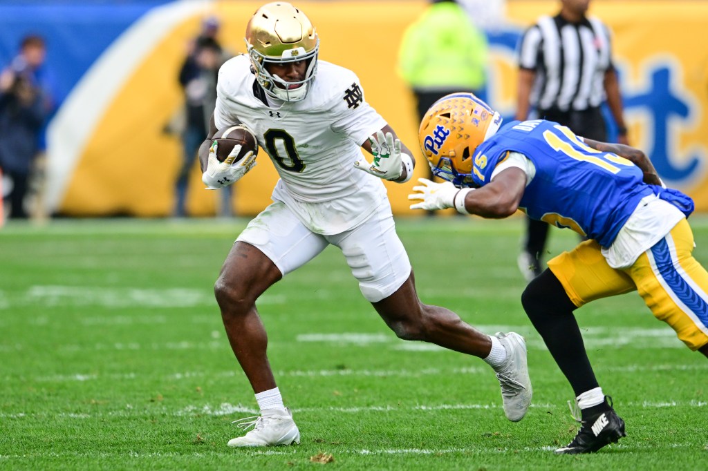 Malachi Fields #0 of the Notre Dame Fighting Irish carries the ball during the second half against the Pittsburgh Panthers