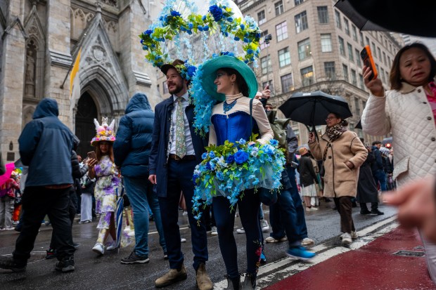 People dress in elaborate hats and costumes during the annual Easter Parade and Bonnet Festival outside of St. Patrick's Cathedral on Fifth Avenue on April 5, 2026 in New York City. (Photo by Spencer Platt/Getty Images)