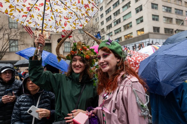 People dress in elaborate hats and costumes during the annual Easter Parade and Bonnet Festival outside of St. Patrick's Cathedral on Fifth Avenue on April 5, 2026 in New York City. (Photo by Spencer Platt/Getty Images)