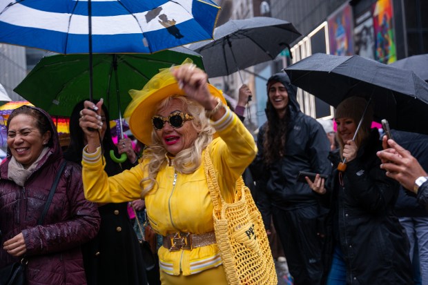 People dress in elaborate hats and costumes during the annual Easter Parade and Bonnet Festival outside of St. Patrick's Cathedral on Fifth Avenue on April 5, 2026 in New York City. (Photo by Spencer Platt/Getty Images)