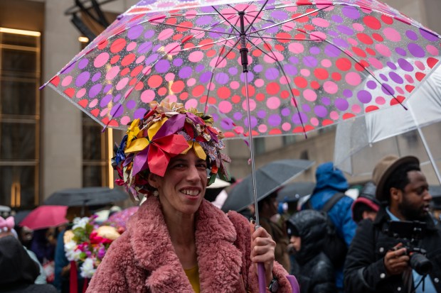 People dress in elaborate hats and costumes during the annual Easter Parade and Bonnet Festival outside of St. Patrick's Cathedral on Fifth Avenue on April 5, 2026 in New York City. (Photo by Spencer Platt/Getty Images)