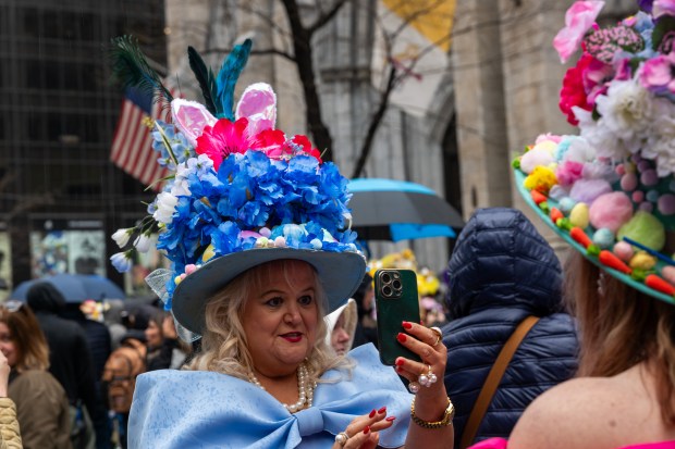People dress in elaborate hats and costumes during the annual Easter Parade and Bonnet Festival outside of St. Patrick's Cathedral on Fifth Avenue on April 5, 2026 in New York City. (Photo by Spencer Platt/Getty Images)