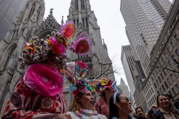 People dress in elaborate hats and costumes during the annual Easter Parade and Bonnet Festival outside of St. Patrick's Cathedral on Fifth Avenue on April 5, 2026 in New York City. (Photo by Spencer Platt/Getty Images)