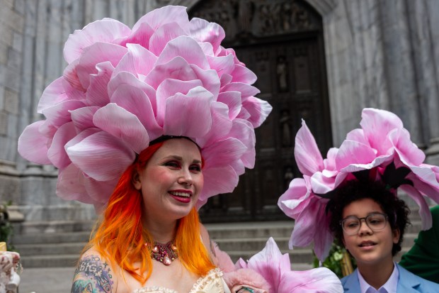 People dress in elaborate hats and costumes during the annual Easter Parade and Bonnet Festival outside of St. Patrick's Cathedral on Fifth Avenue on April 5, 2026 in New York City. (Photo by Spencer Platt/Getty Images)