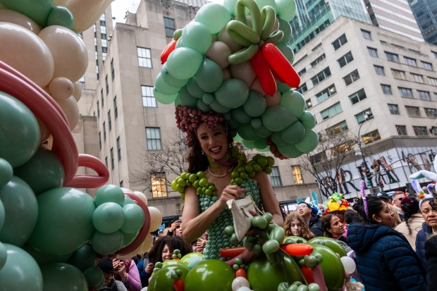 People dress in elaborate hats and costumes during the annual Easter Parade and Bonnet Festival outside of St. Patrick's Cathedral on Fifth Avenue on April 5, 2026 in New York City. (Photo by Spencer Platt/Getty Images)
